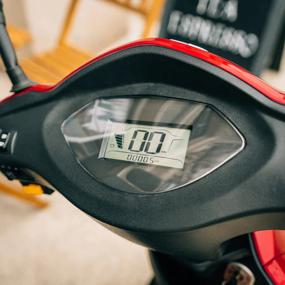 Close-up of Pride Mobility Baja Raptor 2 digital display panel showing speed and battery level